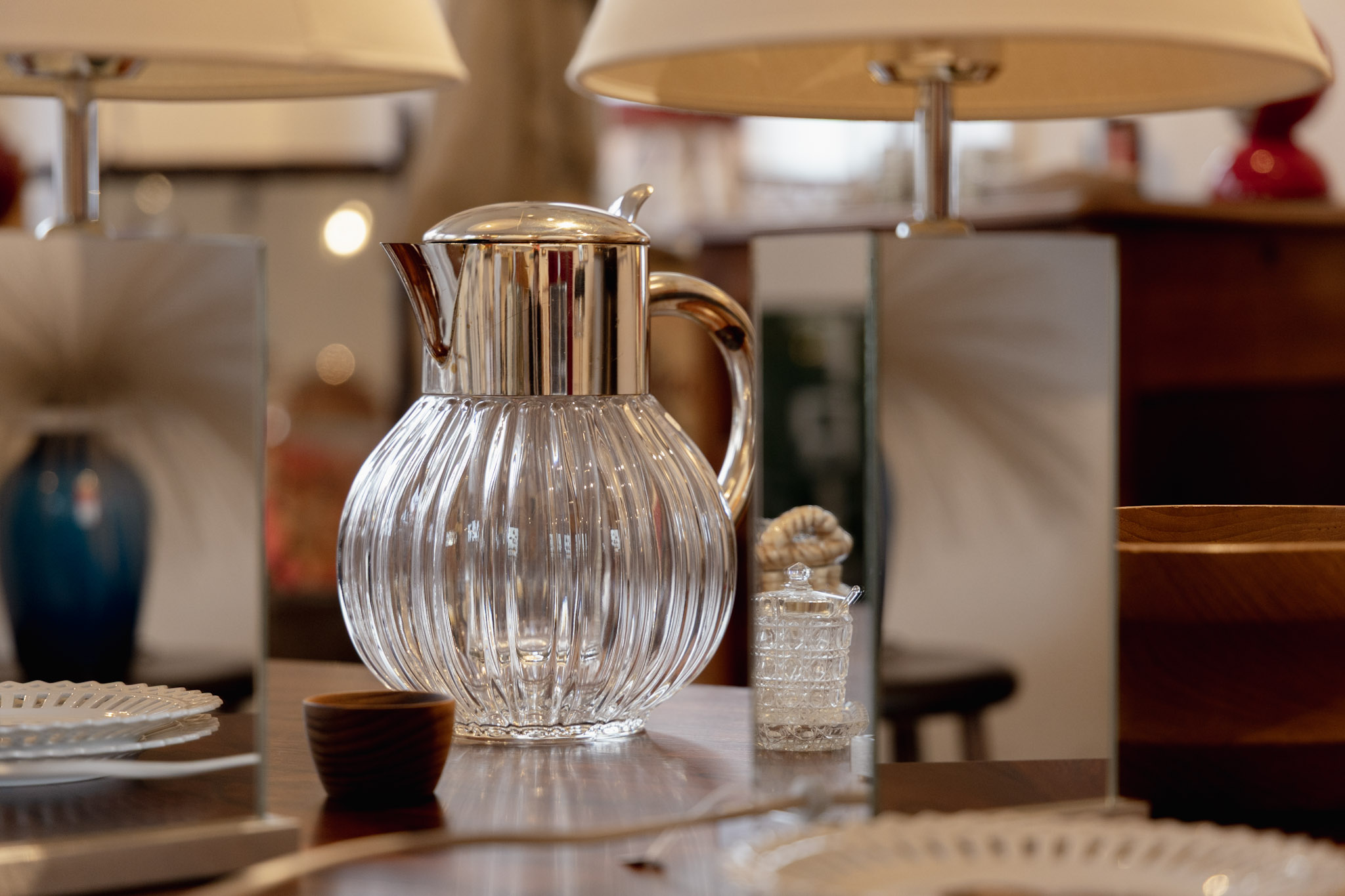 A watering can in a second-hand shop.